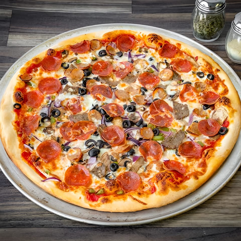 Bianco's Italian Cuisine's fully loaded pizza with pepperoni, sausage, olives, and vegetables.